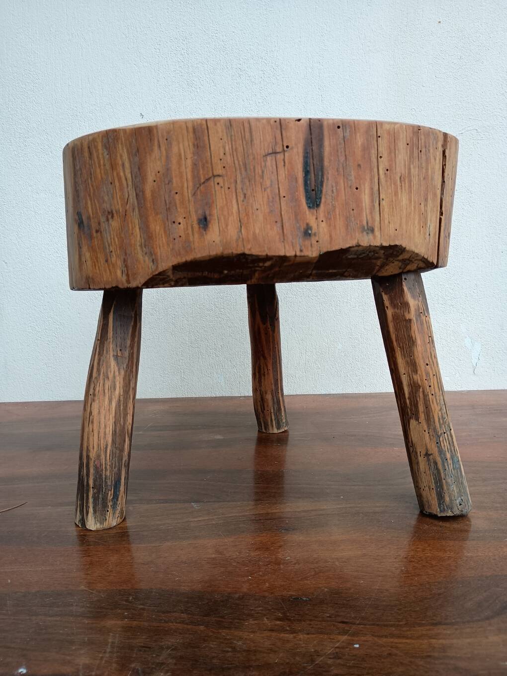 Brutalist tripod coffee table in solid wood.