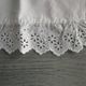 Antique embroidered crescent-shaped cradle pillowcase