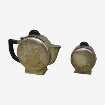 Set of a teapot and a silver metal sugar bowl