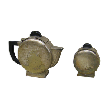 Set of a teapot and a silver metal sugar bowl