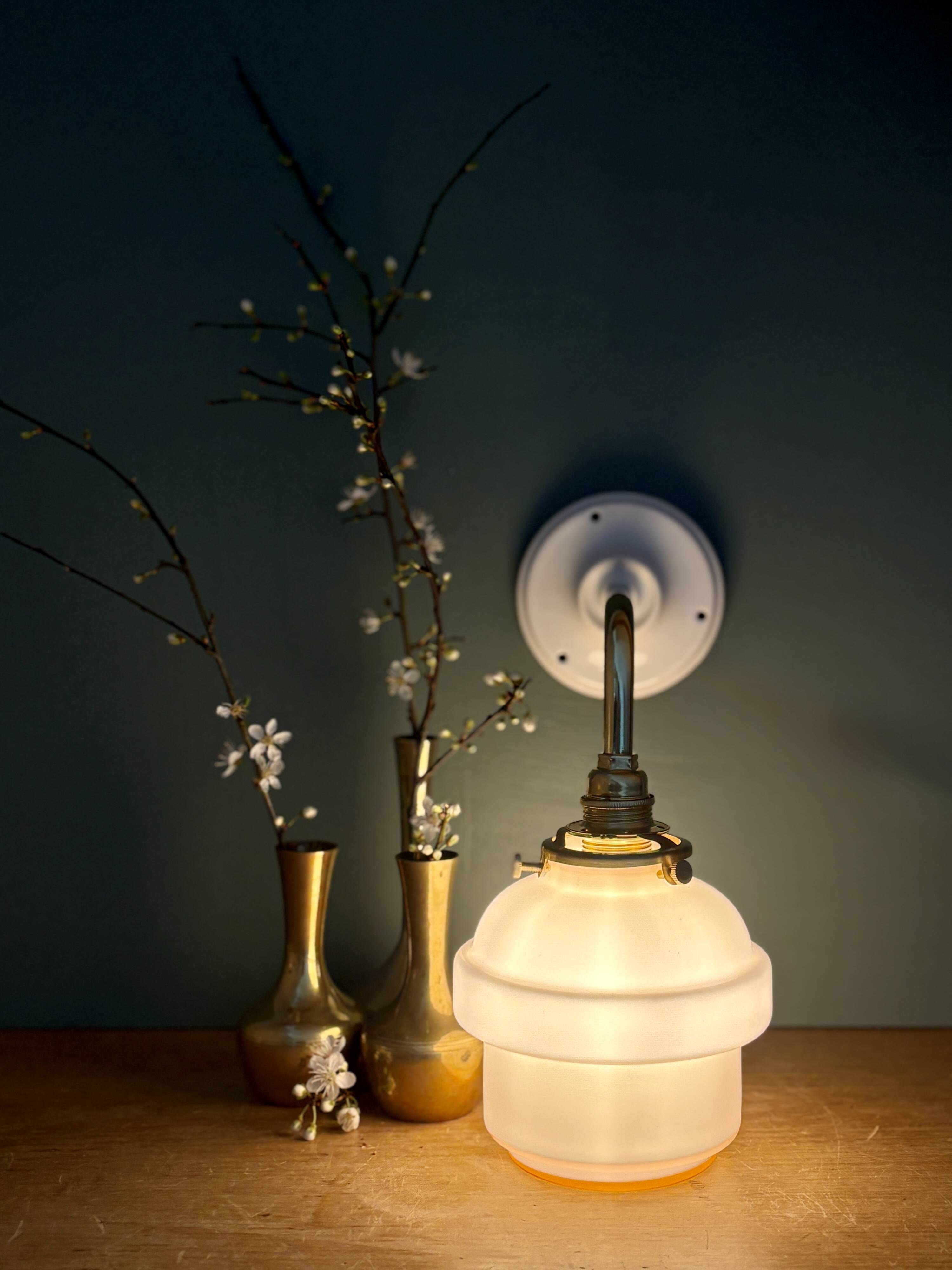 Vintage pink opaline globe wall light.