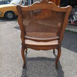 Fauteuil canné sculpté style Régence