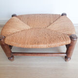 Low wooden stool and straw