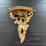 Golden console in rococo style