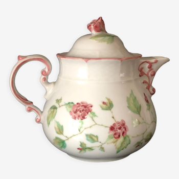 Old white and pink teapot