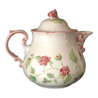 Old white and pink teapot