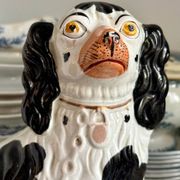 Pair of black Cavalier King Charles dogs in Staffordshire pottery, 19th century.