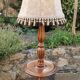 Turned wooden floor lamp with lampshade