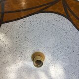 Suspension in the shape of a disc on a seventies style roller