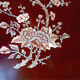 Mahogany gueridon with mother-of-pearl inlays featuring Asian floral decor.