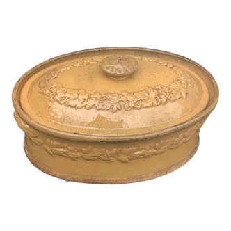 Old terrine in glazed stoneware and floral decoration mustard yellow slip