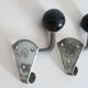Pair of school coat hooks in Bakelite and metal from the 1950s.