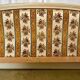 Louis XVI style bed in patinated wood with fluted columns.