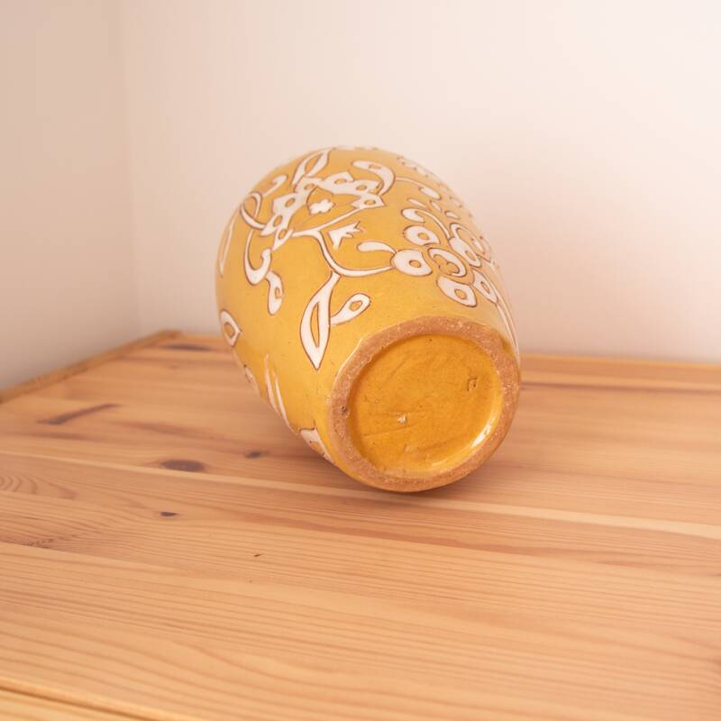 Yellow enamel vase with white flower decoration