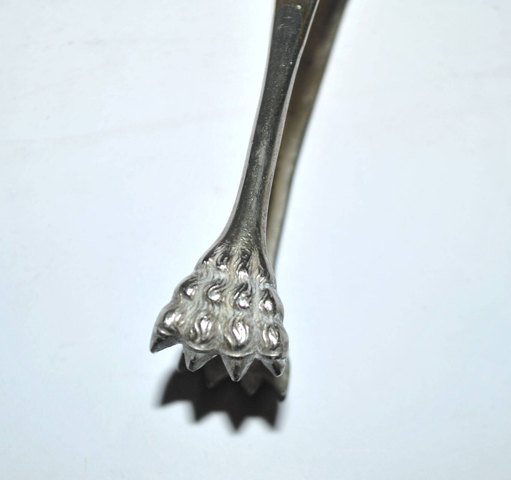 Vintage engraved silver metal lion claw sugar tongs