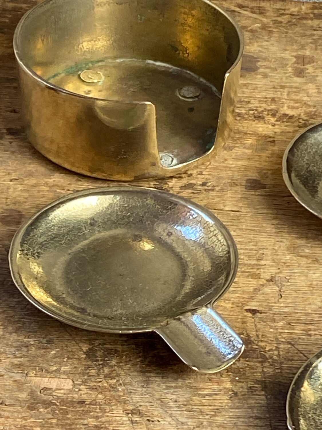 Individual brass ashtrays with storage support