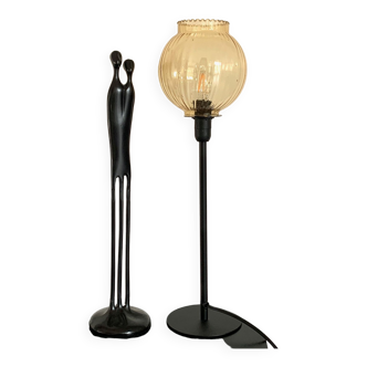 Table lamp with a golden glass lampshade dotted with small bubbles