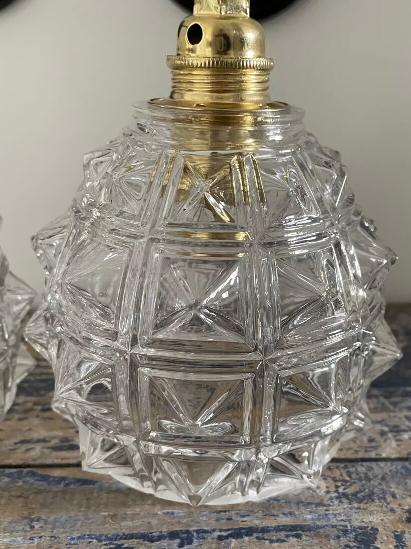 Set of two chiseled glass sconces