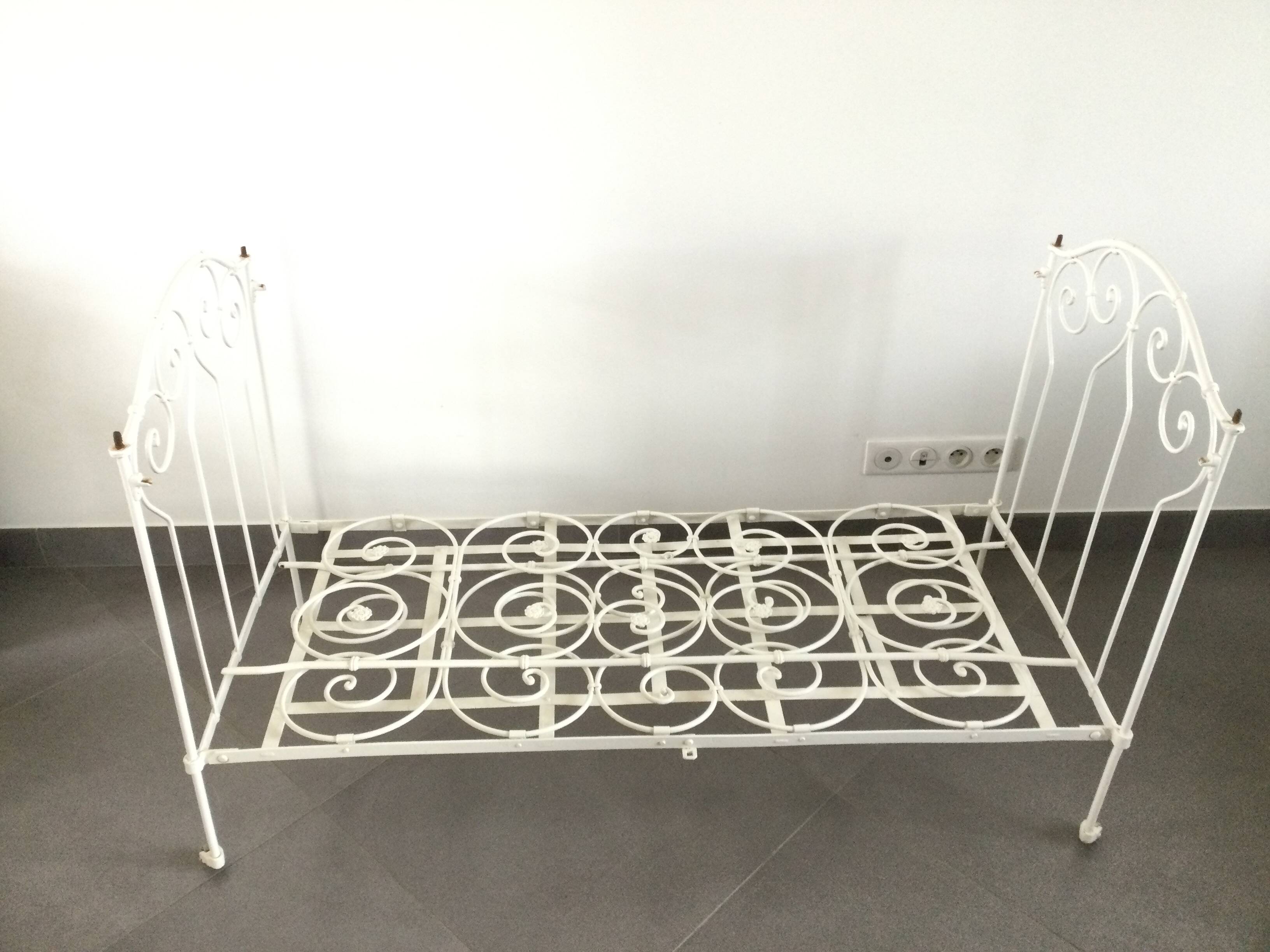 White wrought iron folding bed