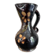 Vase noir à fleurs jaunes