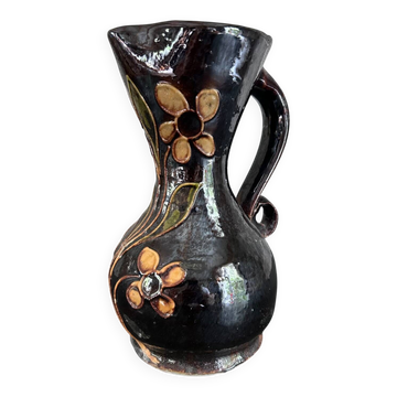 Vase noir à fleurs jaunes