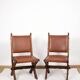 Pair of brutalist style chairs, in wood and leather.