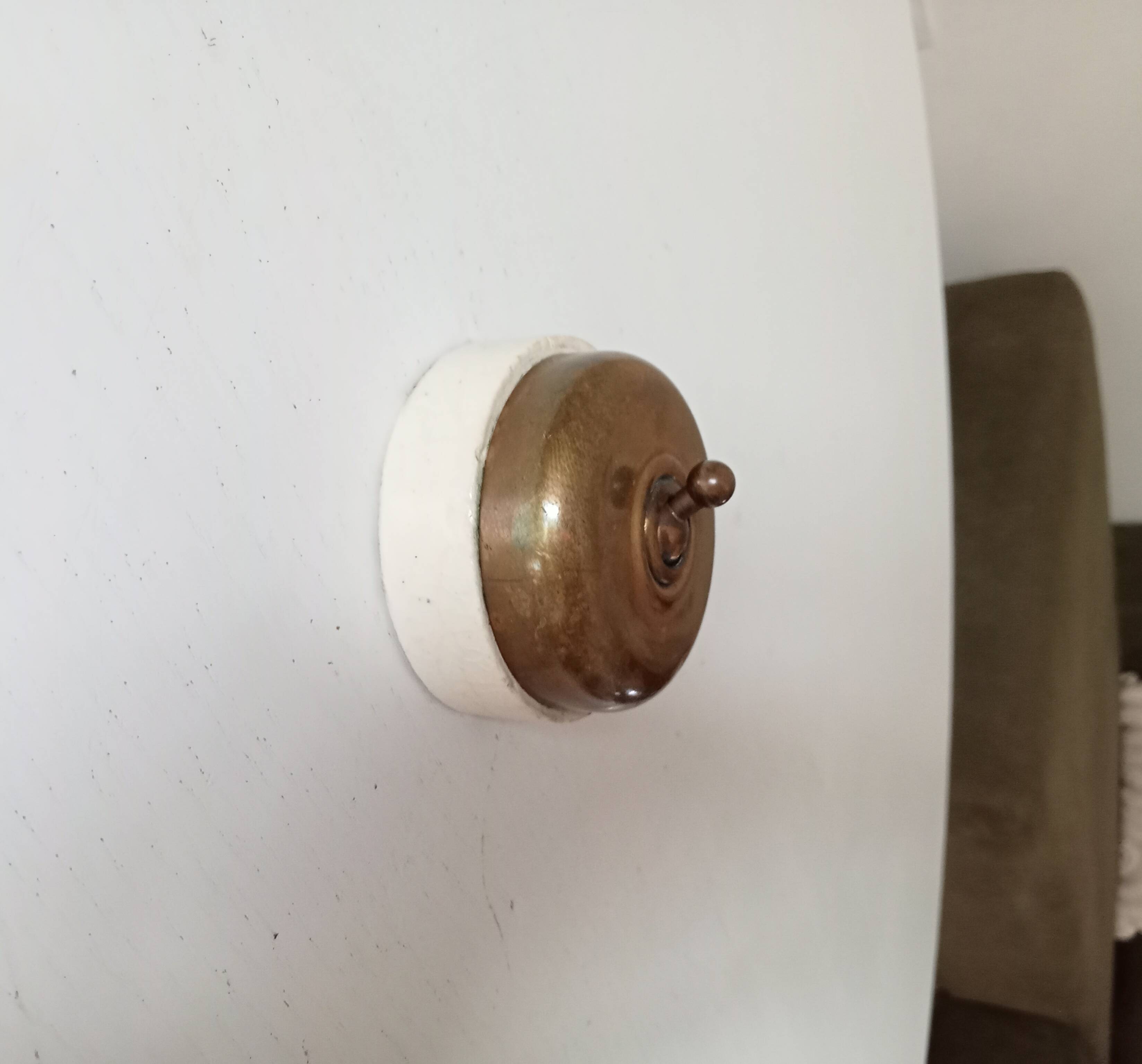 Antique brass and porcelain switch from the 40s/50s