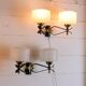 Pair of double wall sconces, Maison Arlus, Mid-Century, black brass opaline