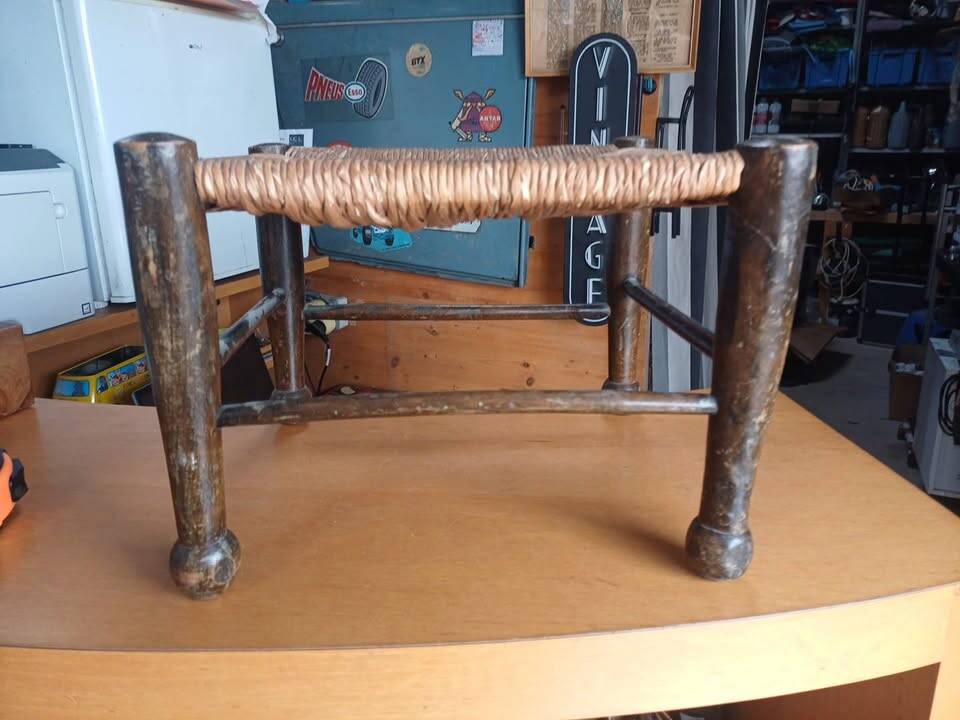 Small rustic vintage stool in wood and straw.
