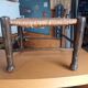 Small rustic vintage stool in wood and straw.