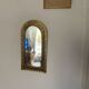 Ethnic brass mirror crafted in the 1980s.