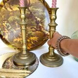 Pair of old candle holders in golden brass