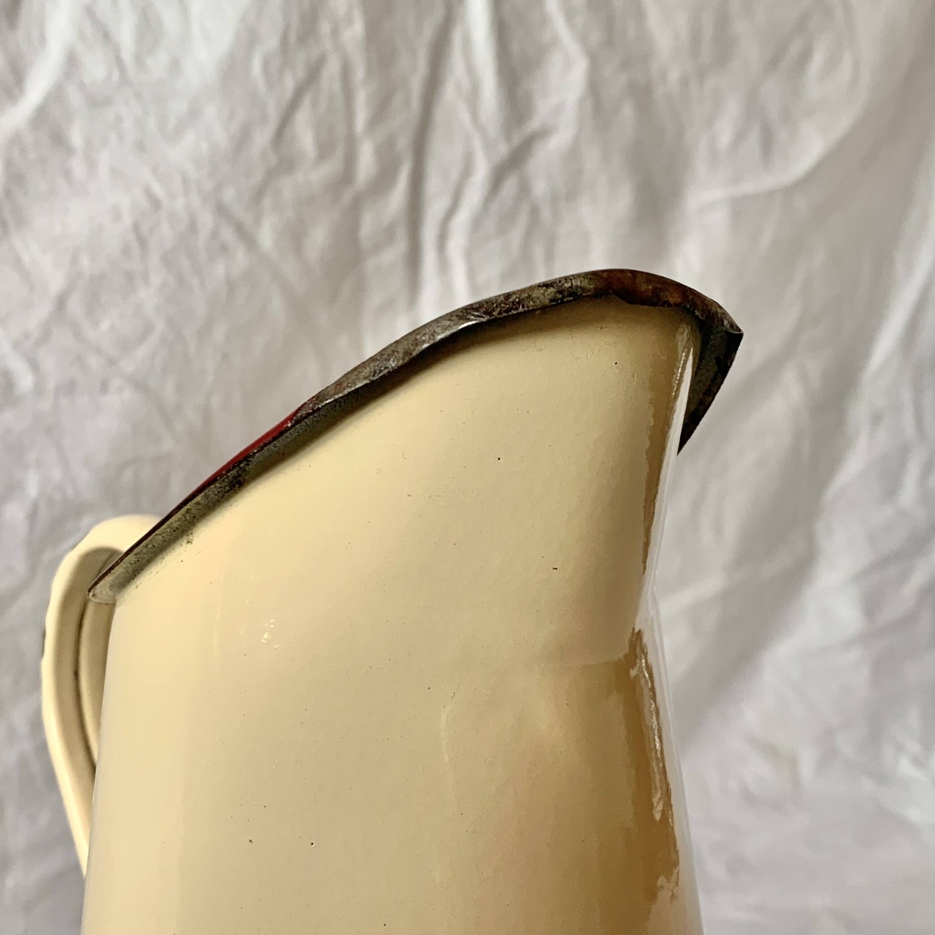 Vintage pitcher or jug in beige enamelled sheet metal