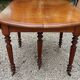 Table ovale 6 pieds avec allonges patine caramel