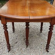 Table ovale 6 pieds avec allonges patine caramel