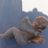 Pair of sitting angel statuettes