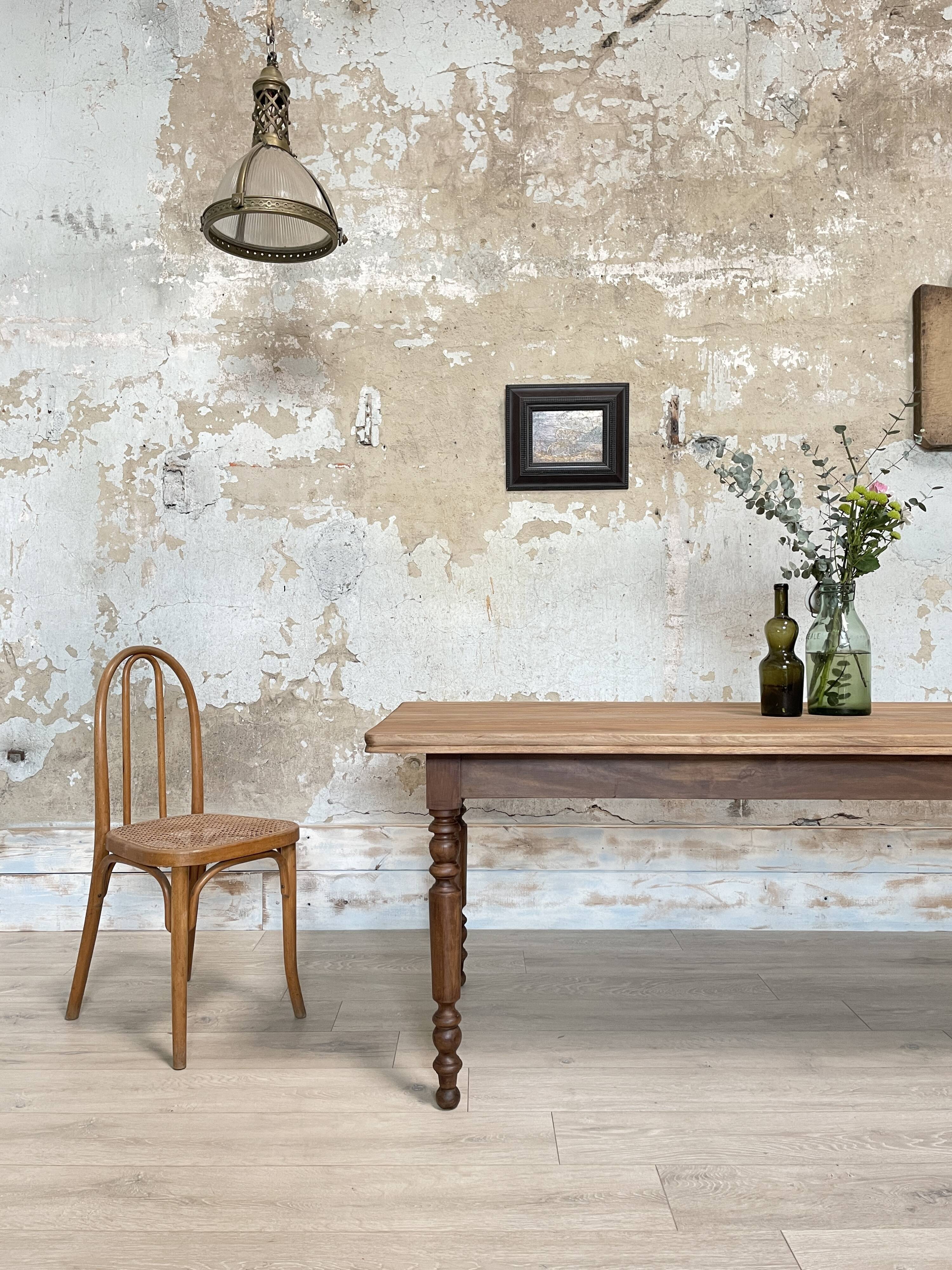Vintage farmhouse table with turned legs.