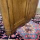 19th-century English corner cabinet in oak, mahogany, and fir.
