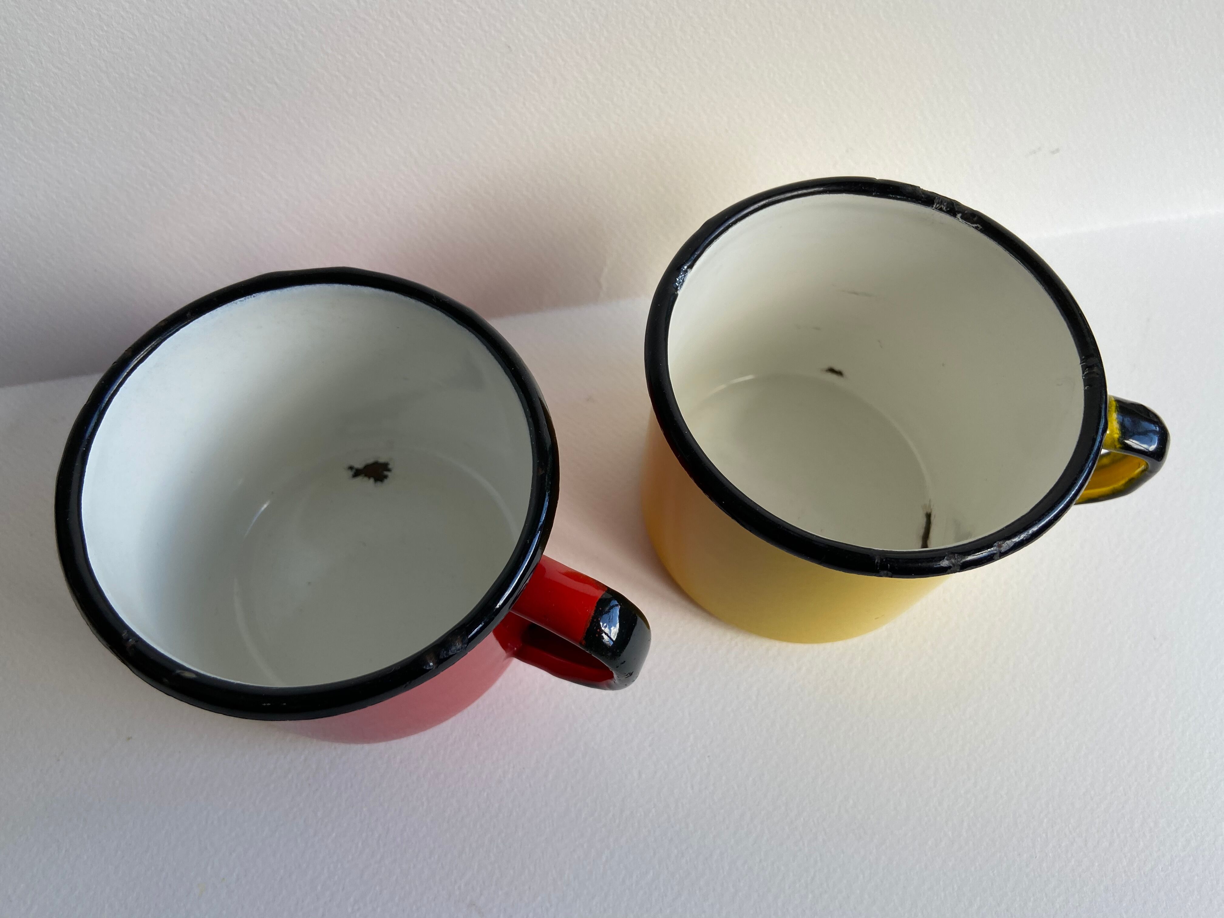 Pair of enamelled sheet metal mugs