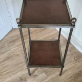Pedestal table in leather and metal
