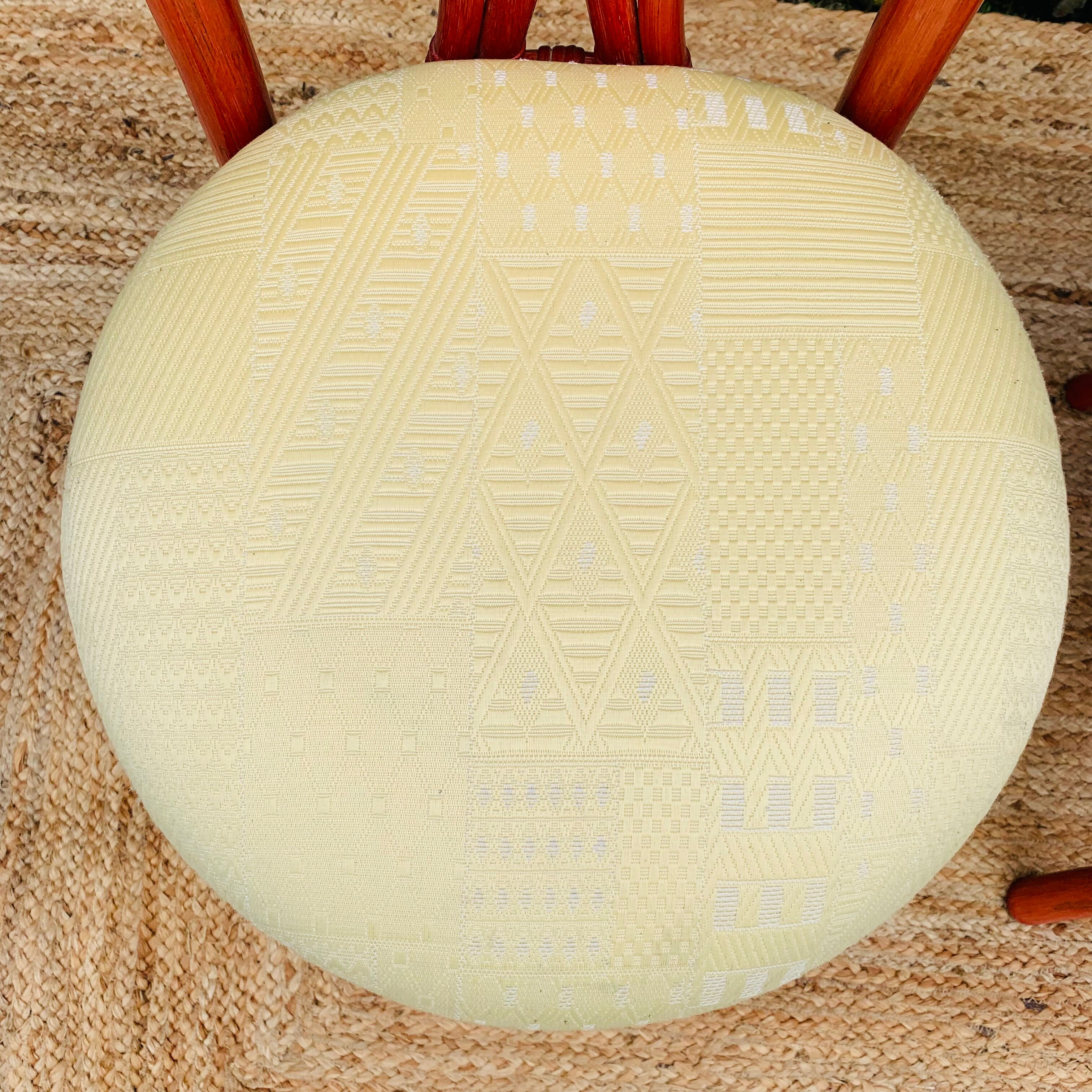 Pair of red rattan chairs and fabric