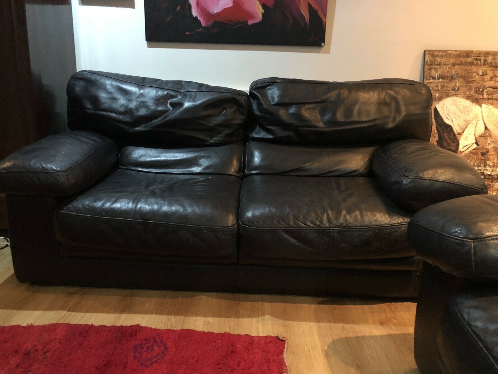 Pair of 2-seater sofas in black leather Roche & Bobois