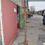 Brown turned beech coat stand, sculpted column, stable tripod.