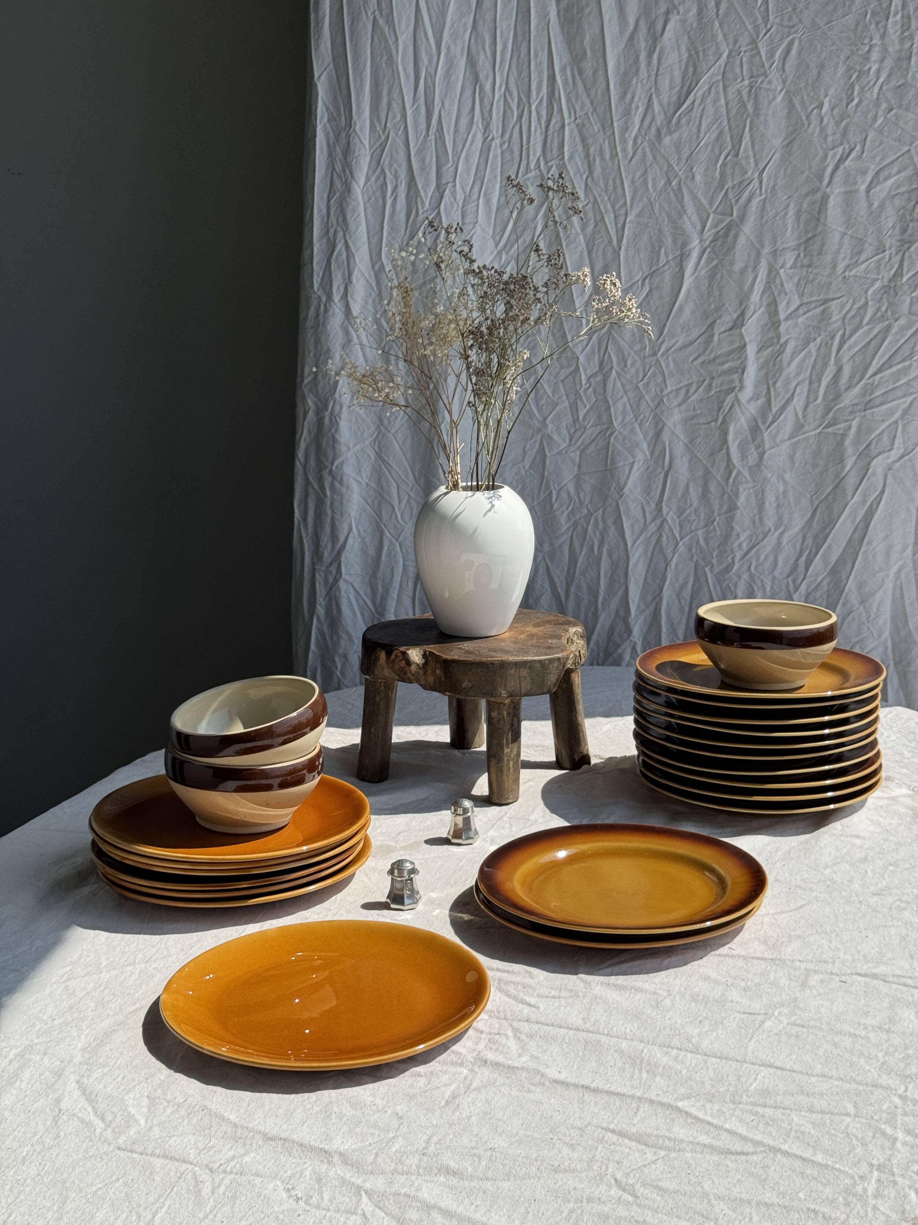 Set of 11 dark brown yellow stoneware plates D24