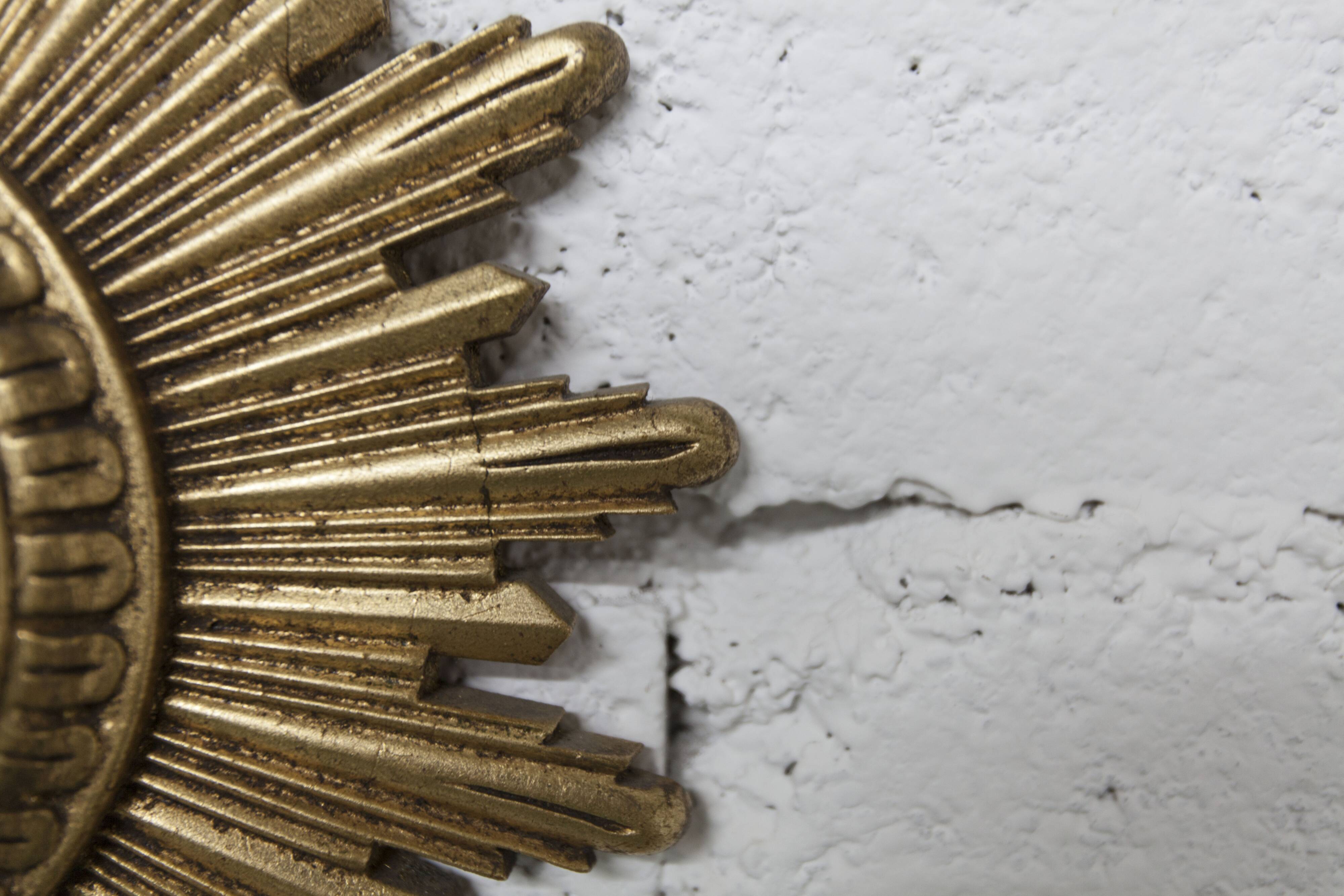 Vintage 1970s convex witch's eye sunburst mirror