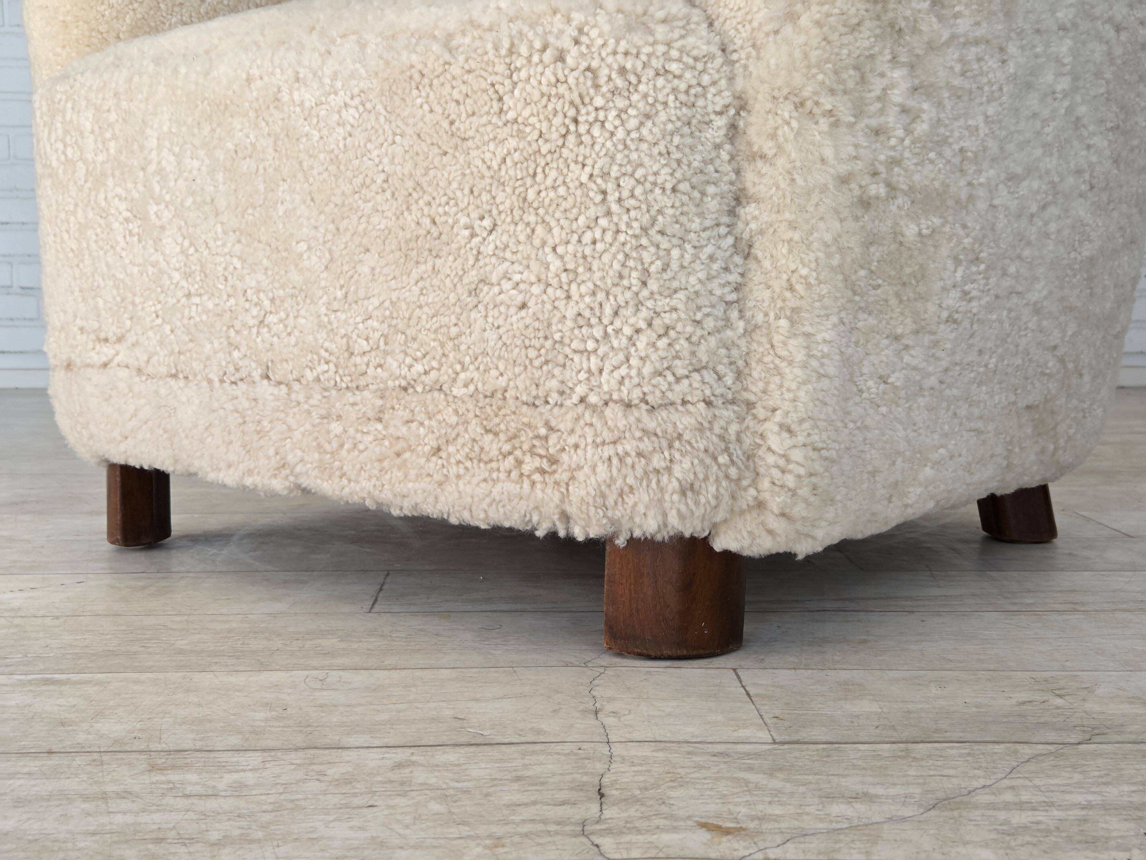 1960s, Danish armchair, genuine sheepskin "Canberra", reupholstered.