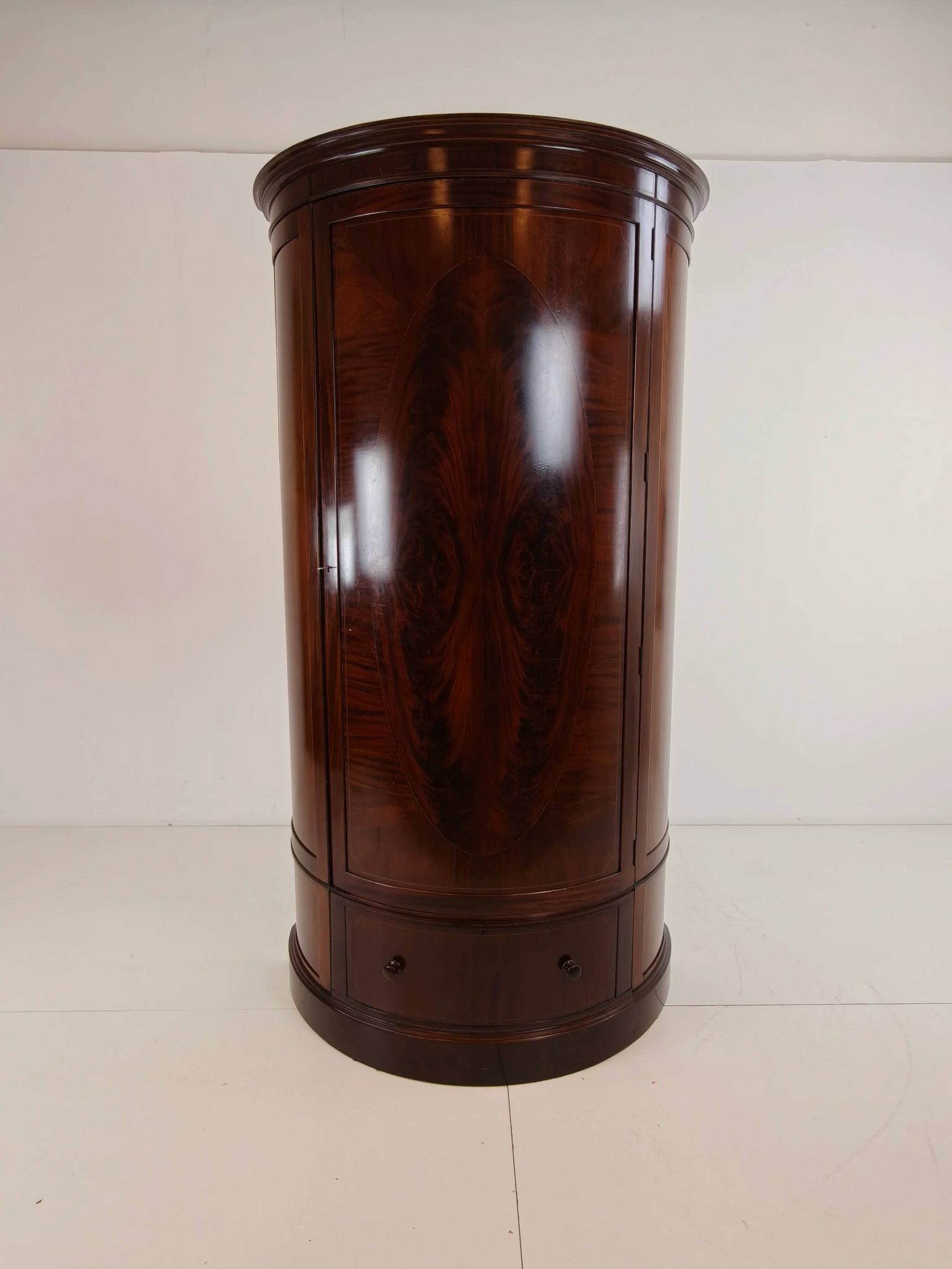 Edwardian mahogany bow-fronted wardrobe by Maple & Co