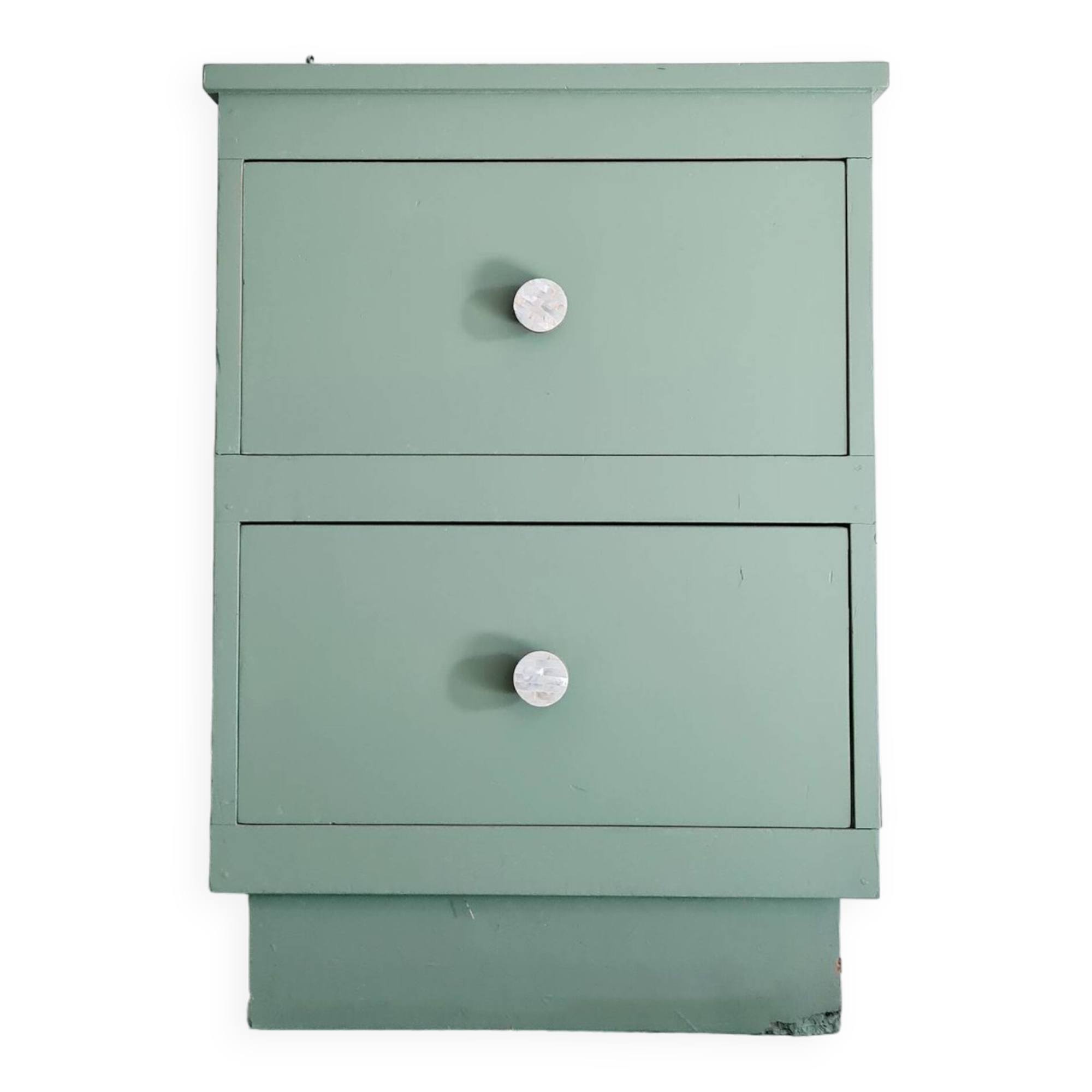 Old chest of drawers with two green drawers