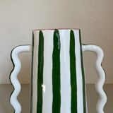 Green and white striped ceramic vase with abstract handmade corrugated handheld