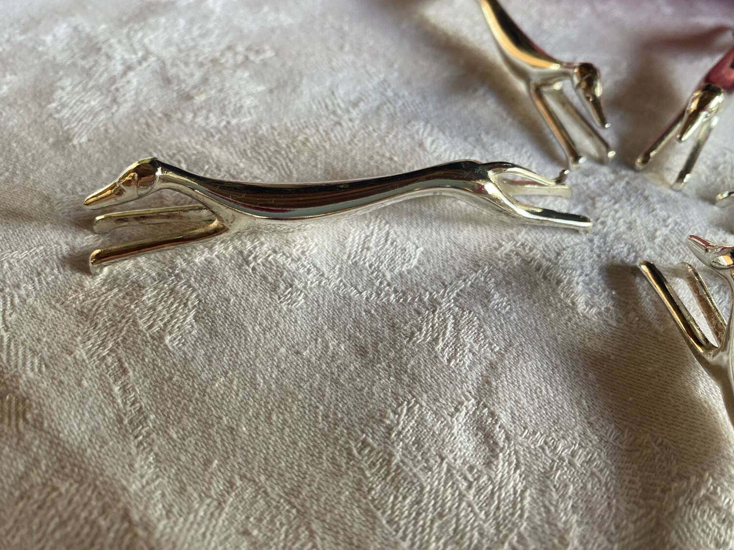 Set of 6 greyhound knife holders in silver metal